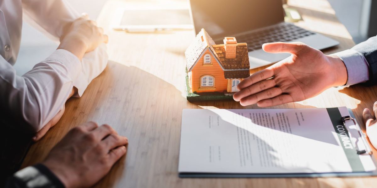 Business Signing a Contract Buy - sell house.