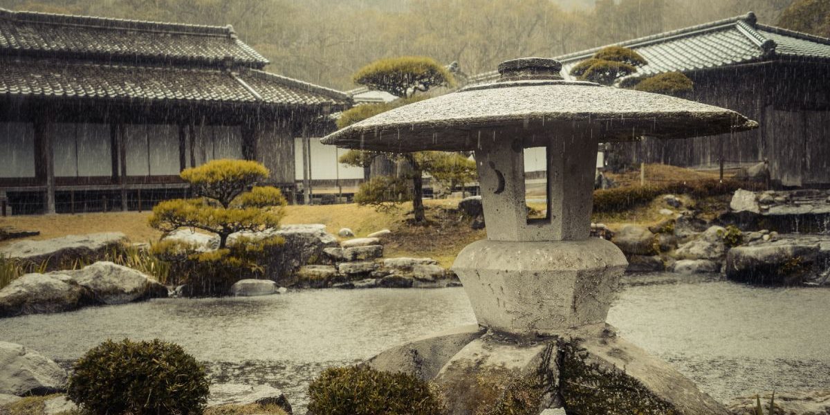 Pagoda statue in a Japanese garden on a rainy day
