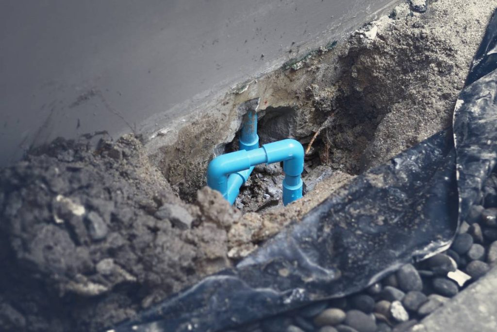 Water pipe blue color underground in the house which broken or damage cause of leaking clean water and need to fix or maintenance by plumber suggestion such as apply glue to re-connect it.