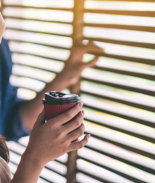 A man and a woman drinking coffee together