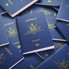 Passports of Australia background. Immigration or travel concept. Pile of australian passports. 3d illustration