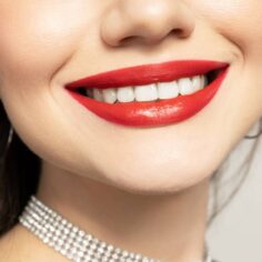 Lips of a young girl close-up on a light background